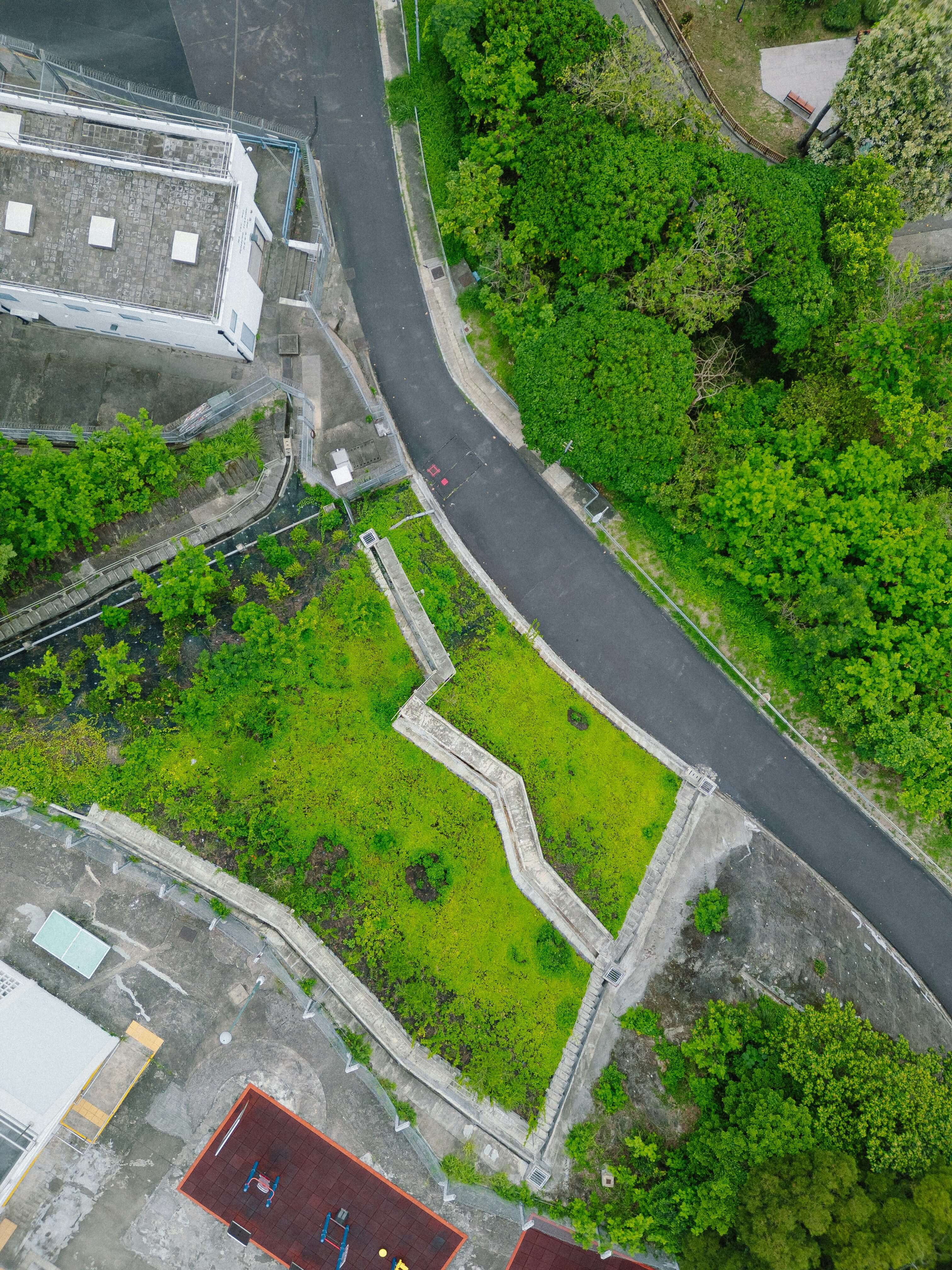 Aerial view of vacant infill lot with road access